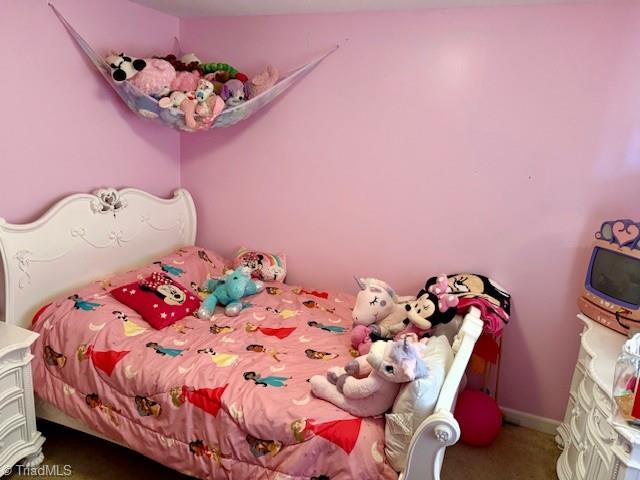 bedroom featuring carpet flooring