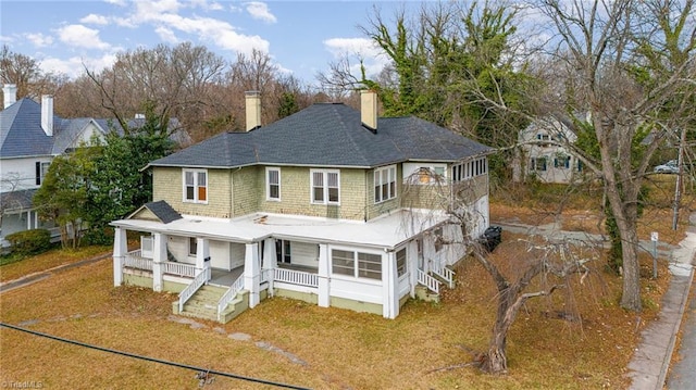 rear view of house with covered porch