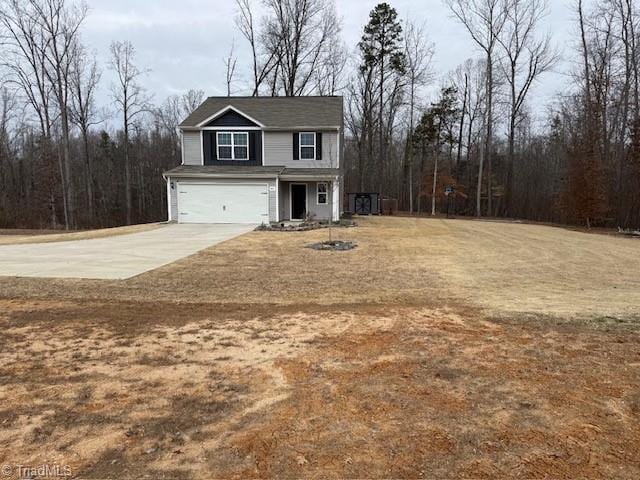 view of front facade with a garage and a front lawn