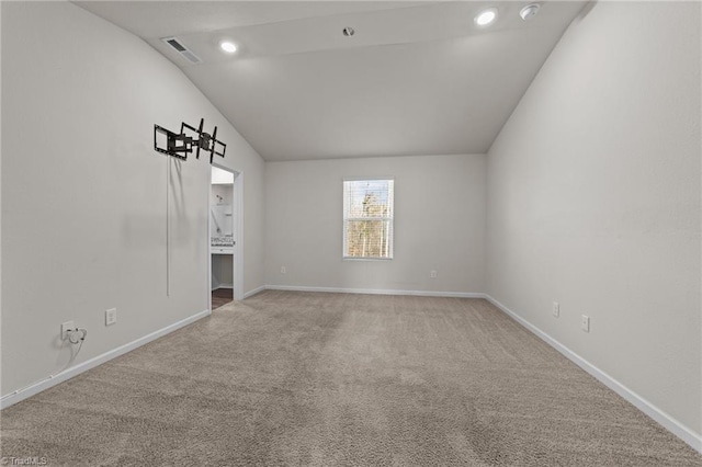 interior space featuring carpet and lofted ceiling