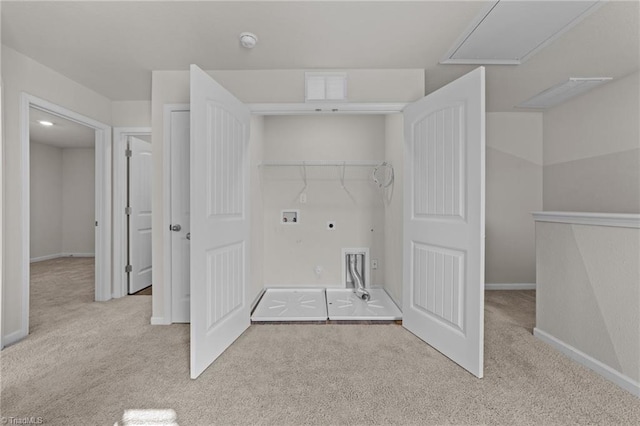 washroom with washer hookup, light carpet, and electric dryer hookup