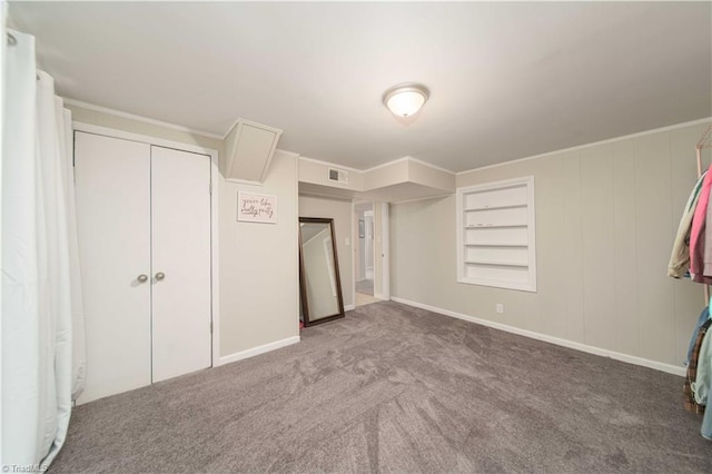 unfurnished bedroom with carpet floors and a closet