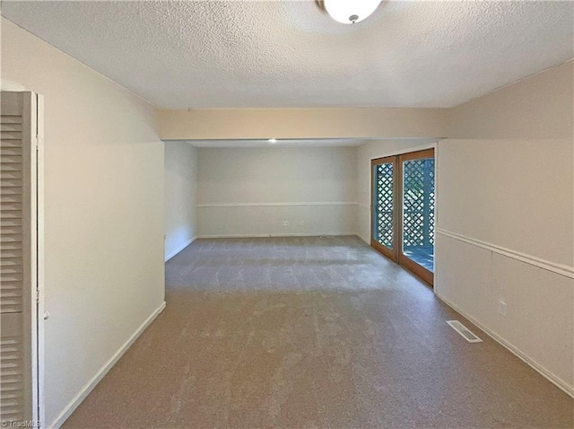 6630 Riverwood Rd, Walkertown, NC 27051 - below grade area featuring carpet flooring and a textured ceiling