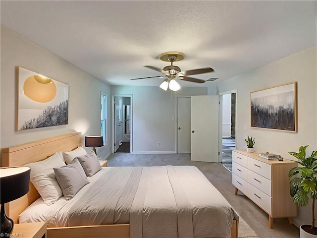 6630 Riverwood Rd, Walkertown, NC 27051 - bedroom featuring light carpet, a ceiling fan, and ensuite bath