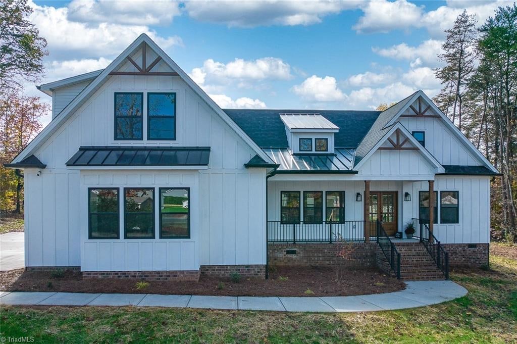 modern inspired farmhouse with covered porch