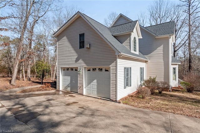 view of home's exterior with a shingled roof