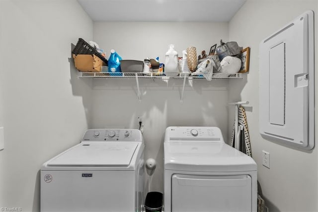 washroom featuring washer and clothes dryer