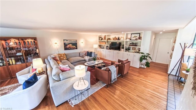 3307 Gaston Rd, Greensboro, NC 27407 - living area with wood finished floors and built in shelves