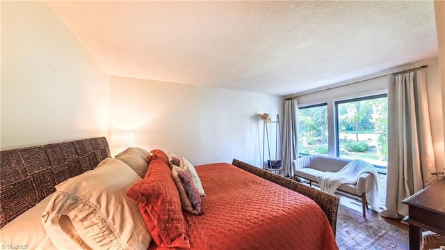 3307 Gaston Rd, Greensboro, NC 27407 - bedroom featuring wood finished floors and a textured ceiling