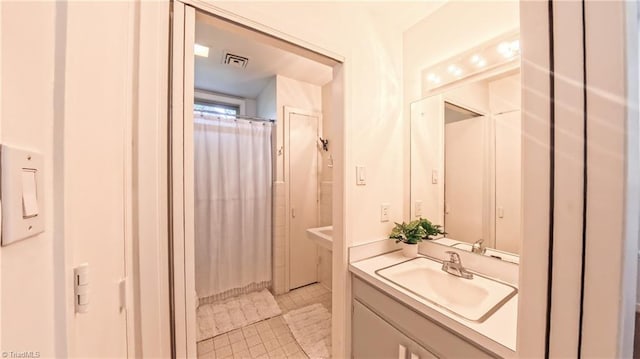 3307 Gaston Rd, Greensboro, NC 27407 - bathroom featuring vanity and curtained shower