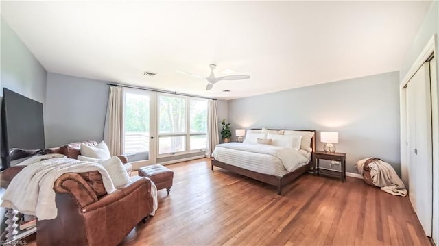 3307 Gaston Rd, Greensboro, NC 27407 - bedroom with wood finished floors, a closet, a ceiling fan, and baseboards