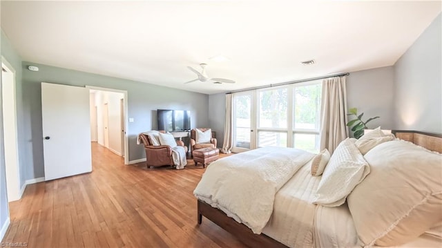 3307 Gaston Rd, Greensboro, NC 27407 - bedroom with light wood-style floors, a ceiling fan, and baseboards