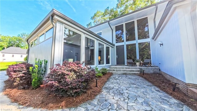 3307 Gaston Rd, Greensboro, NC 27407 - back of property featuring a sunroom