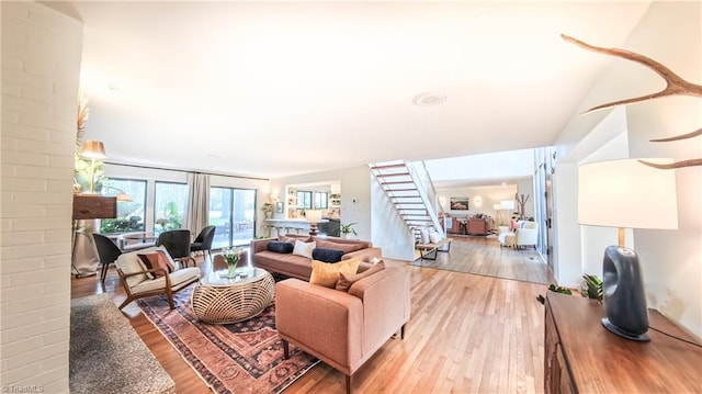 3307 Gaston Rd, Greensboro, NC 27407 - living room featuring light wood-style flooring and stairway