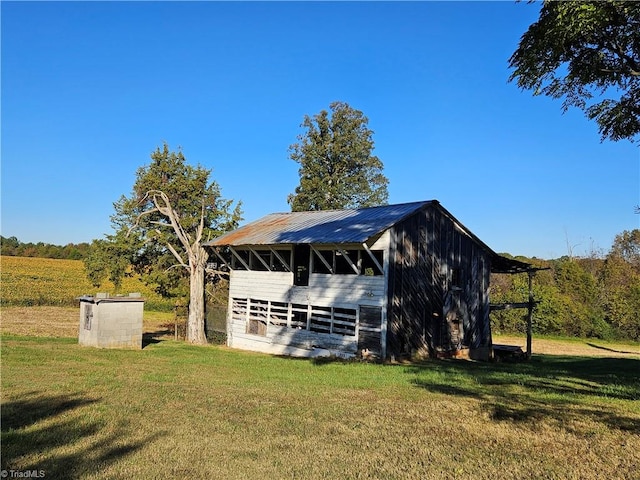 exterior space featuring a yard and a rural view