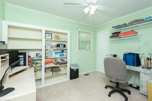 office area with crown molding, ceiling fan, and carpet