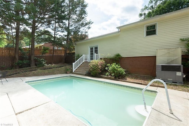 view of swimming pool featuring a fenced in pool and fence