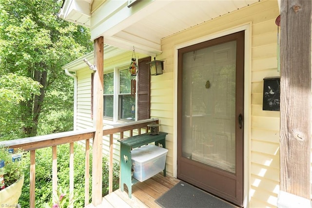 view of exterior entry with covered porch