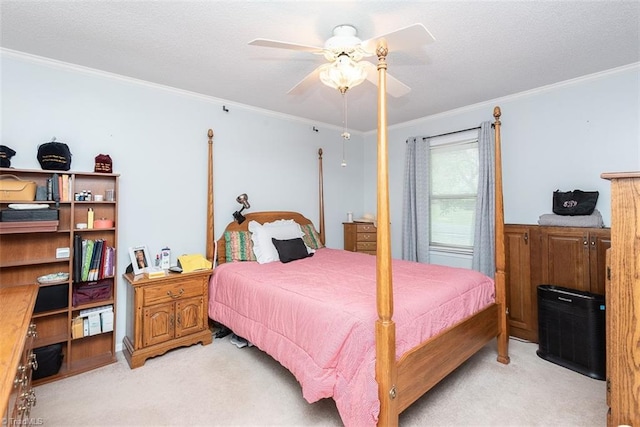 bedroom with light colored carpet, ornamental molding, and a ceiling fan