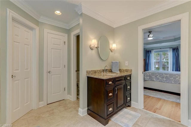 ensuite bathroom with tile patterned flooring, vanity, recessed lighting, ensuite bathroom, and ornamental molding