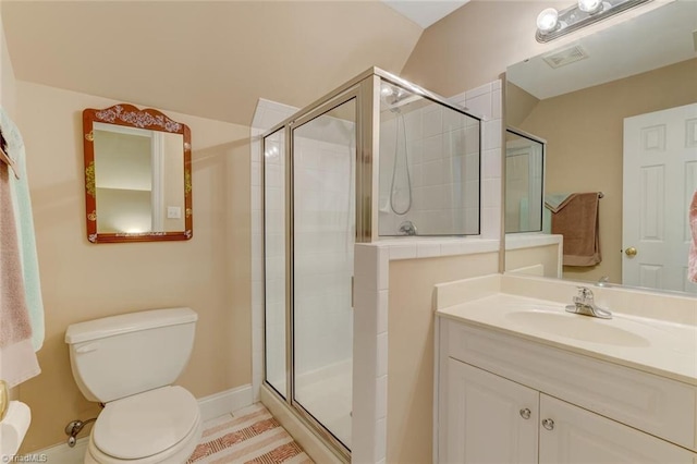 bathroom with visible vents, a stall shower, toilet, and vanity