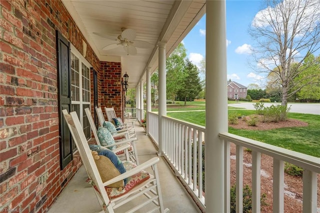 balcony with a porch and ceiling fan