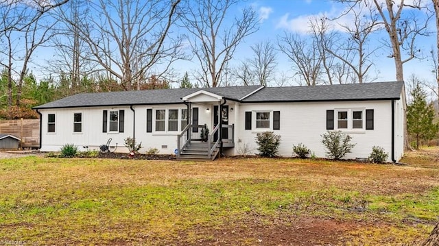 single story home featuring a front lawn