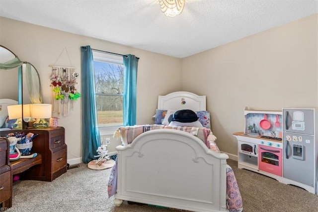 carpeted bedroom featuring a textured ceiling