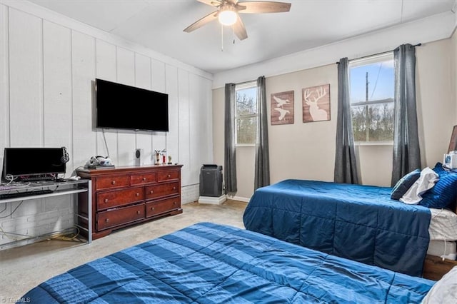 bedroom featuring ceiling fan and light colored carpet