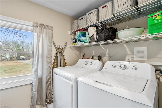 laundry area with washer and clothes dryer