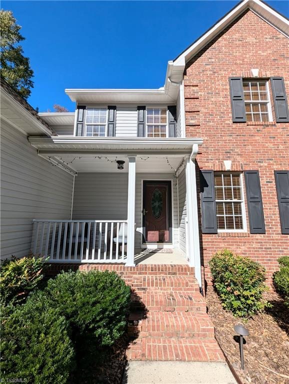 doorway to property with a porch