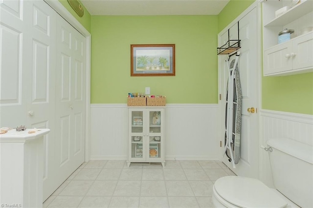 bathroom with tile patterned floors and toilet