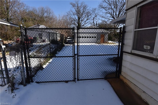 view of snow covered gate