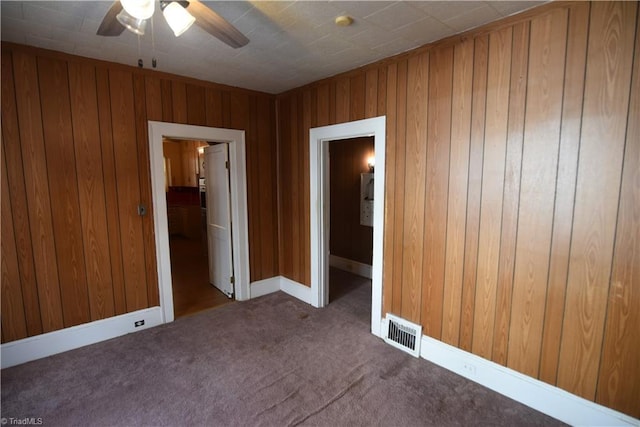 unfurnished room with ceiling fan and carpet floors