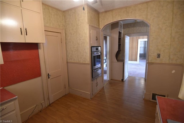 kitchen featuring hardwood / wood-style floors and oven