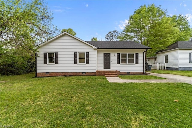 ranch-style house featuring a front lawn, crawl space, and a shingled roof