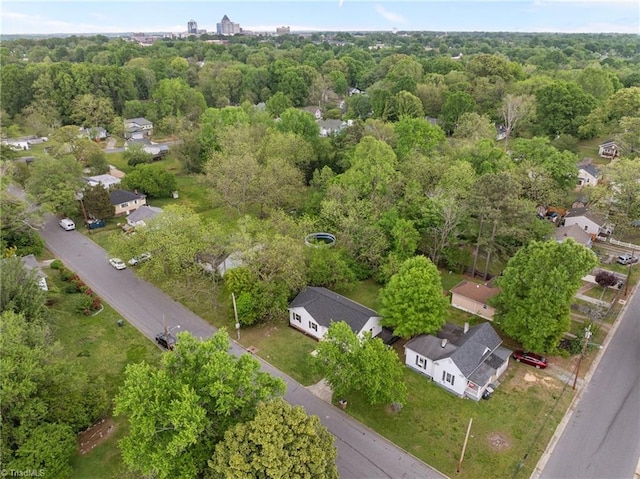 birds eye view of property with a forest view
