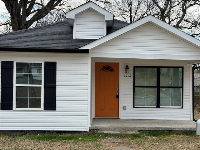 view of front of home featuring a shingled roof