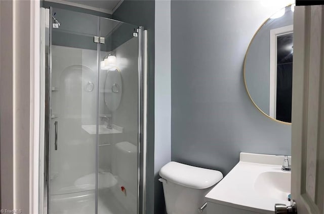 bathroom with vanity, toilet, and an enclosed shower