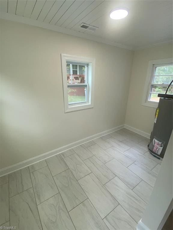 820 Broad Ave, Greensboro, NC 27406 - empty room with visible vents, marble finish floor, baseboards, and crown molding