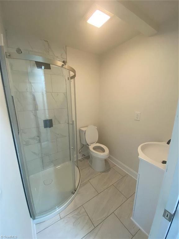 820 Broad Ave, Greensboro, NC 27406 - bathroom featuring vanity, baseboards, a stall shower, and toilet