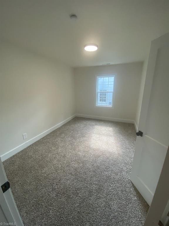 820 Broad Ave, Greensboro, NC 27406 - carpeted empty room with baseboards