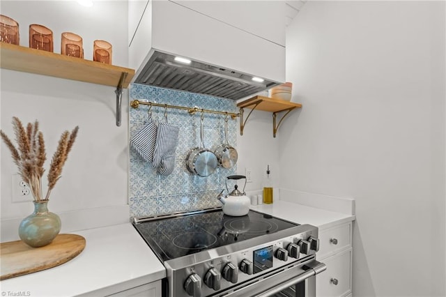 kitchen with open shelves, light countertops, stainless steel range with electric stovetop, and white cabinetry