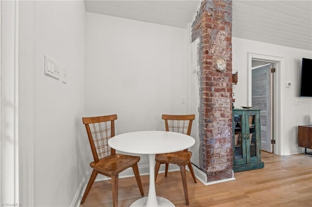 dining room with light wood-type flooring and baseboards