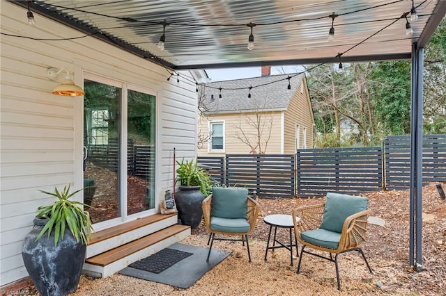 view of patio featuring fence