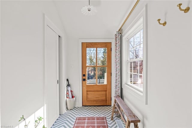 entryway featuring lofted ceiling