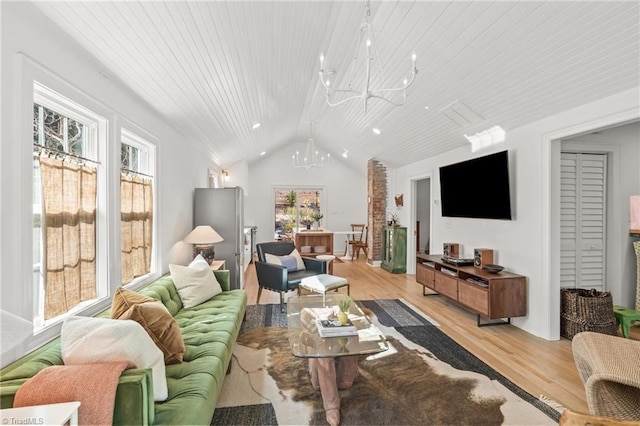 living room with lofted ceiling, light wood-style floors, wooden ceiling, and an inviting chandelier