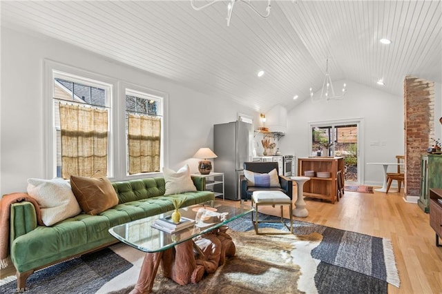 living area featuring vaulted ceiling, light wood-type flooring, wooden ceiling, and baseboards