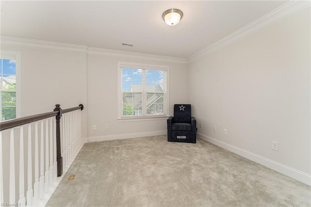 unfurnished room featuring light colored carpet and ornamental molding