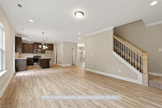 4099 Stallion St Lot 18, High Point, NC 27262 - unfurnished living room with crown molding, recessed lighting, baseboards, light wood-style floors, and stairs